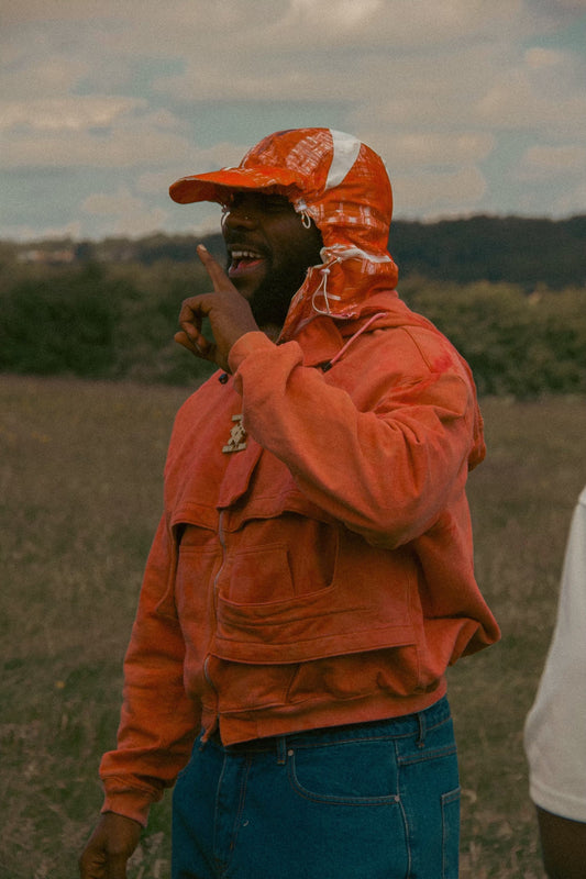 ODUMODUBLVCK wearing Danis Thapa in 'Devil Wears White' Music Video